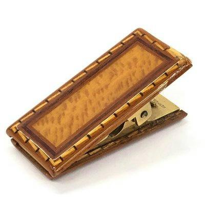 Rectangular HERMES wood desk clip with a gold-tone metal hinge shown on a white background.
