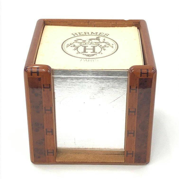 Front view of the wooden HERMES memo block holder containing a stack of HERMES-branded notepaper with the Hermes logo visible on top.