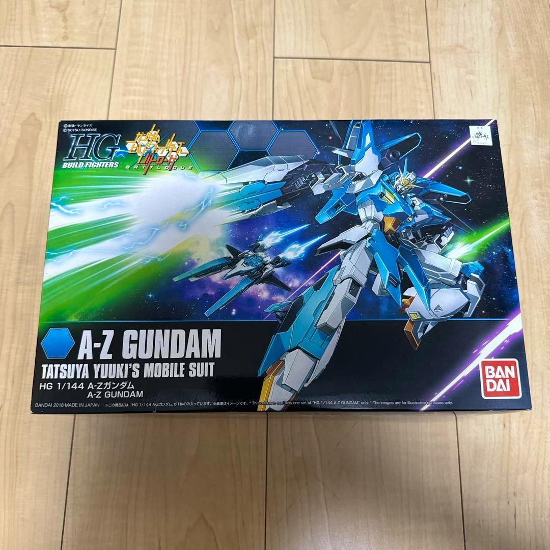 Front view of the boxed HG 1/144 A-Z Gundam model kit showing the box artwork and bandai logo.