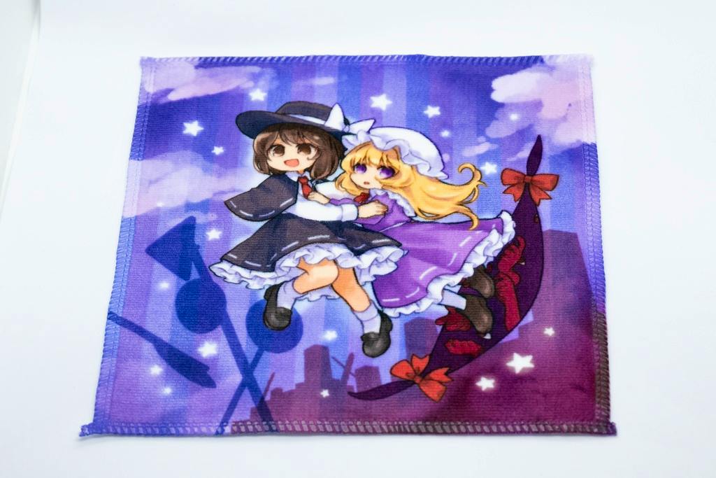 A square polyester handkerchief laid flat with a purple illustrated design of two girls and star motifs.