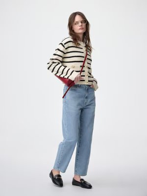 Model wearing the women's high-rise straight jeans standing against a white background.