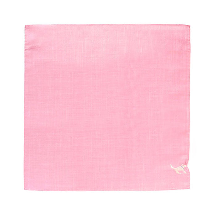 A pink HIKKOMI handkerchief shown flat with a small embroidered white dog in the lower-right corner.