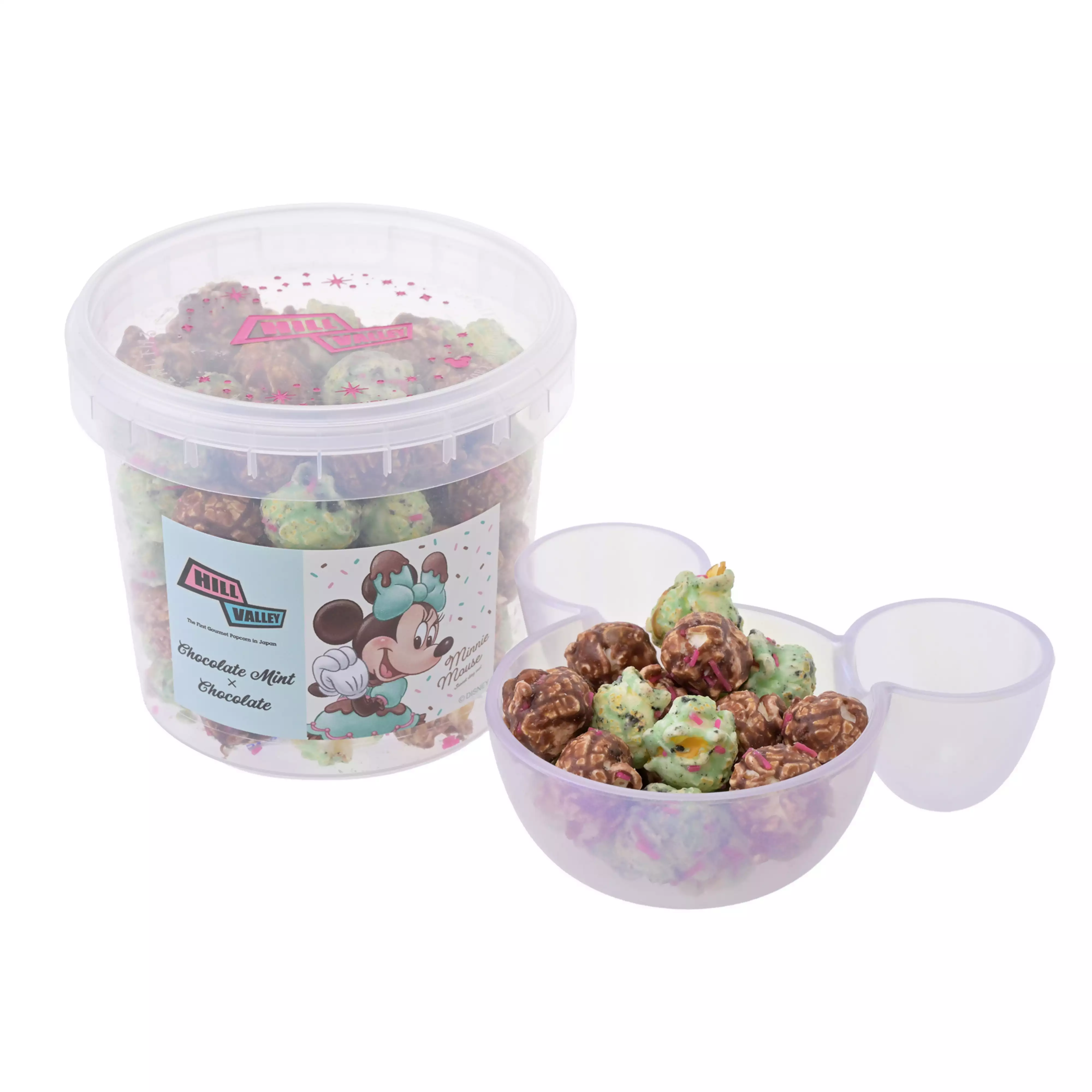 Clear plastic tub of HillValley "Minnie" chocolate mint × chocolate popcorn with some popcorn shown in a clear Mickey-head shaped bowl.