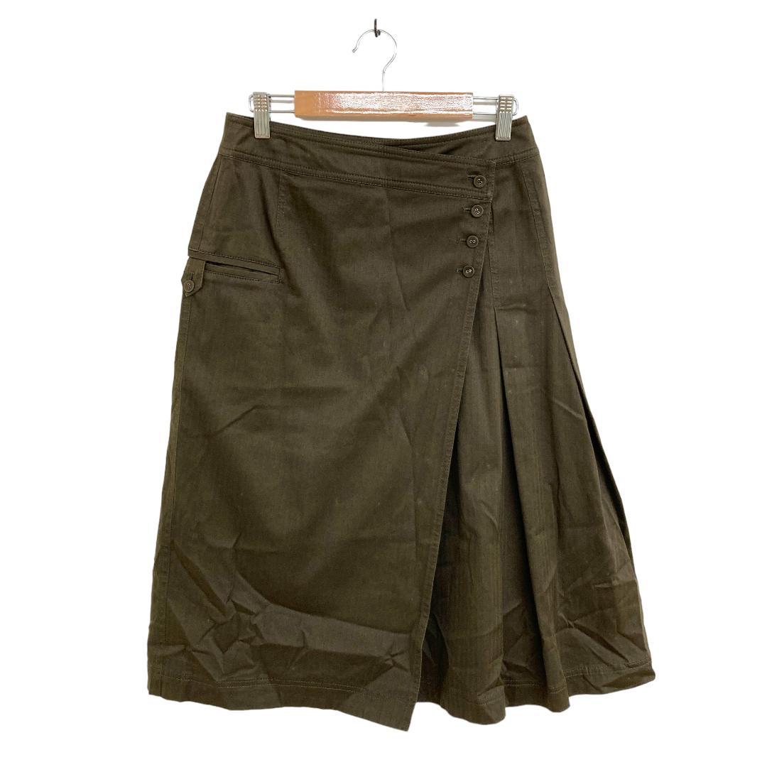 Khaki flared skirt hanging on a hanger shown from the front.
