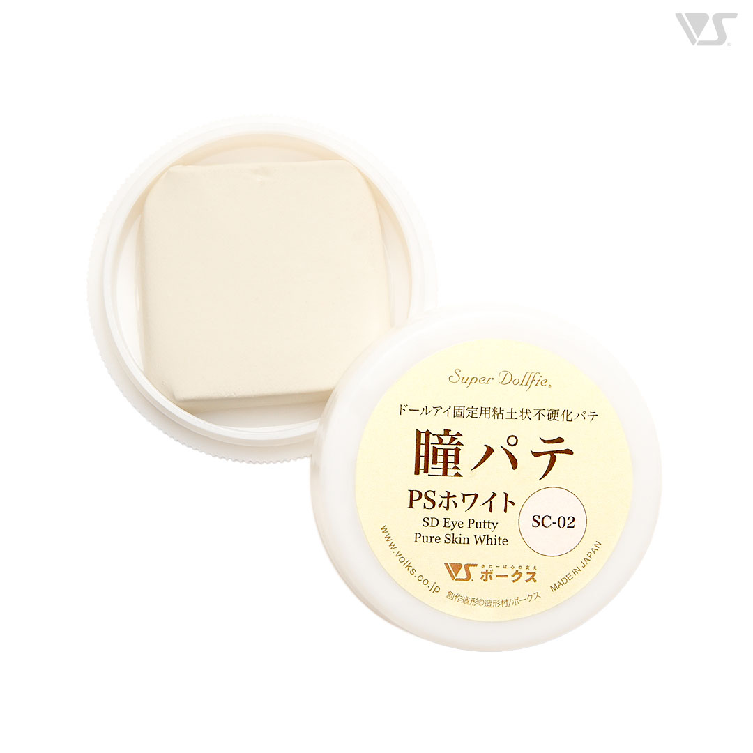 Open pot of PS White eye putty showing a white putty block and the lid labeled with Japanese text 瞳パテ PSホワイト.