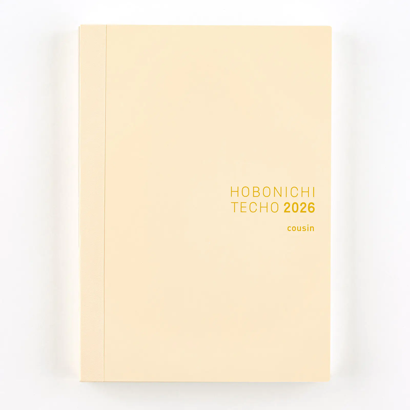 Front cover of the Hobonichi Techo 2026 English Cousin A5 daily notebook with a pale beige cover and gold title text.