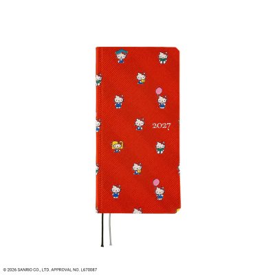 Red Hobonichi Techo 2027 notebook with small Hello Kitty motifs on the cover and two ribbon page markers.