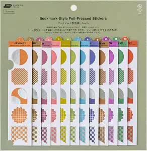 Bookmark-style foil-stamped paper stickers in assorted colors displayed in their packaging.