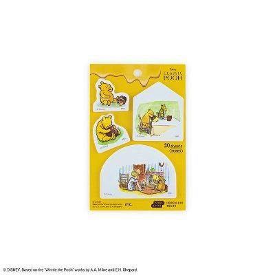 Packaged set of Winnie‑the‑Pooh themed sticky notes displayed on a yellow backing card.