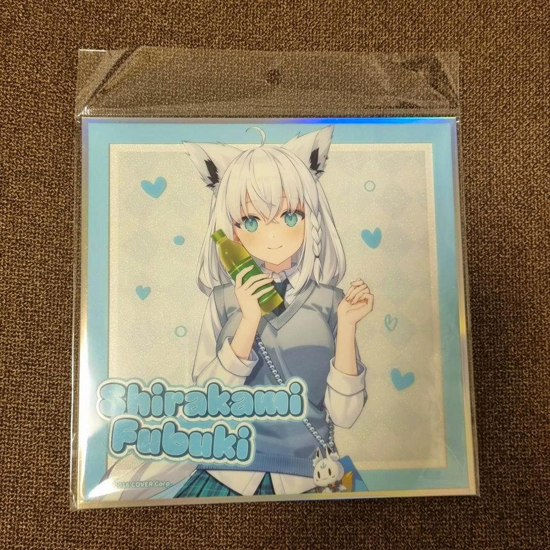 Packaged shikishi picture board showing hololive character Shirakami Fubuki holding a bottle against a blue-bordered background.