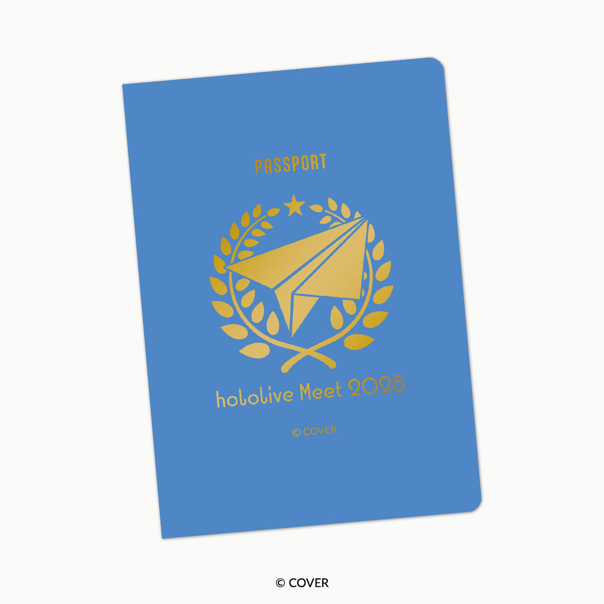 Front of the 'hololive Meet 2025' passport-style notebook with a blue cover and gold emblem and text.
