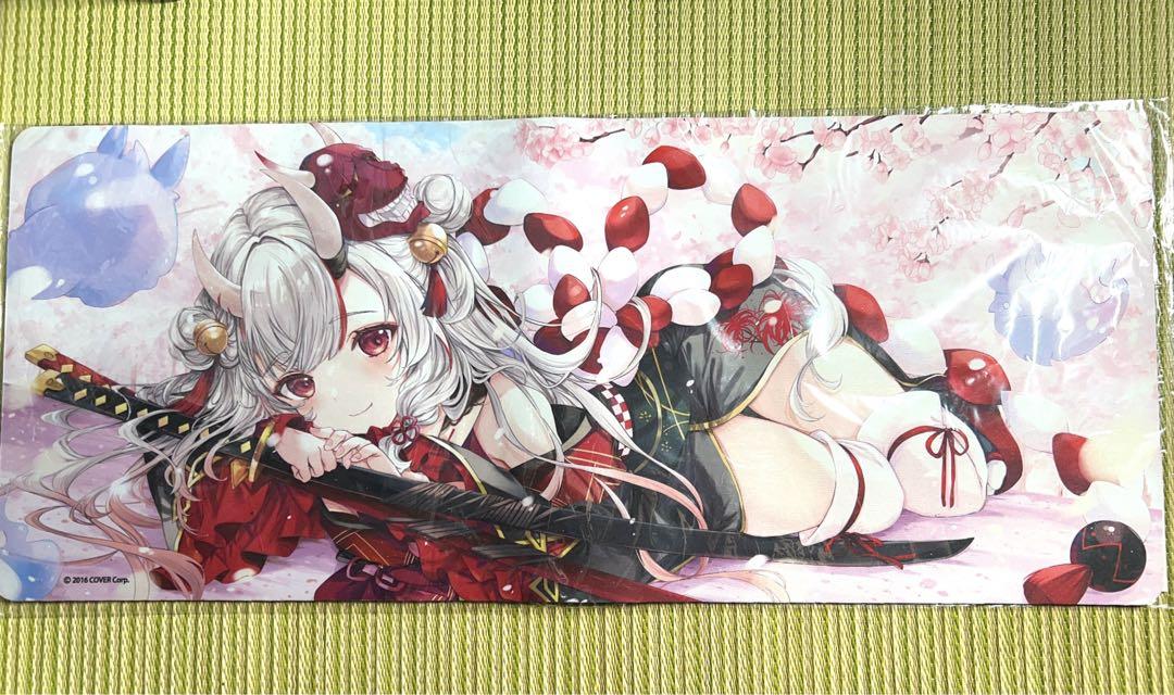 Wide rubber playmat (polyester) with printed anime character artwork laid flat on a green surface.