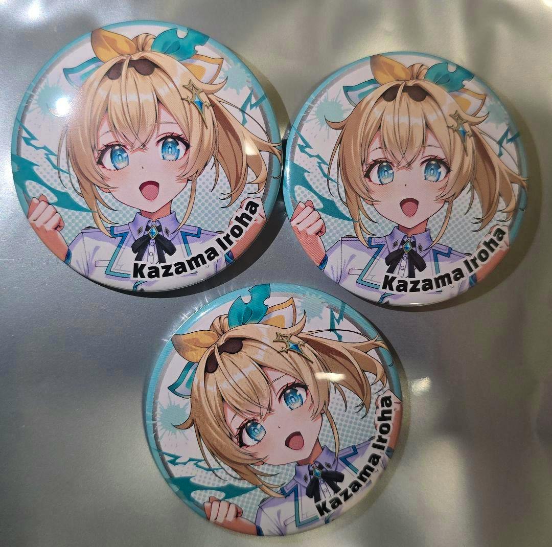 Three round can badges featuring the Hololive character Kazama Iroha arranged on a metallic surface.