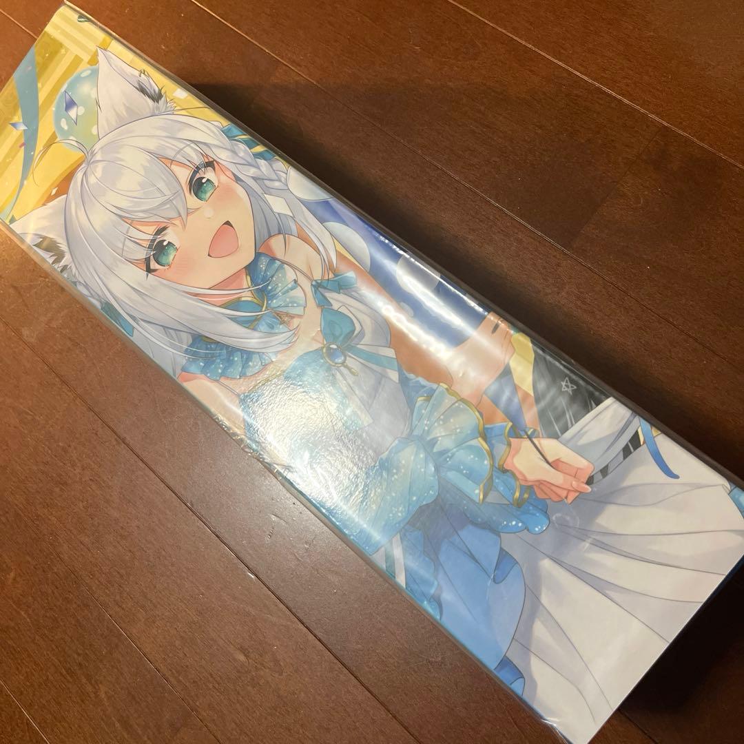 Packaged rubber playmat showing a full-color illustration of Shirakami Fubuki placed on a wooden floor.
