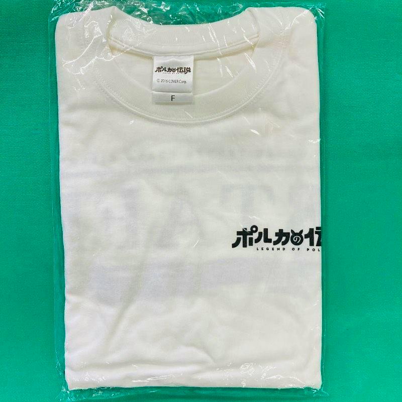 Folded white staff T-shirt sealed in plastic showing a size tag and a partial printed logo on a green background.
