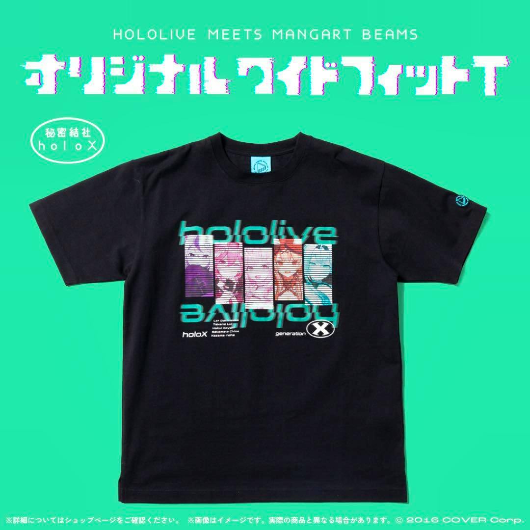 A black hololive wide-fit T-shirt laid flat on a green background showing a holoX 6th generation character graphic on the front.