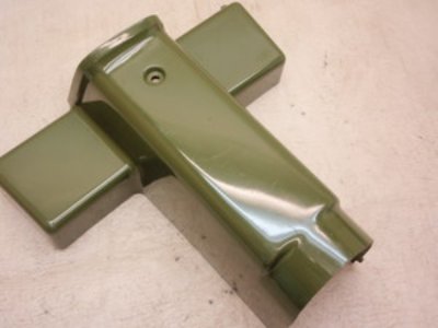 Green plastic inner cover panel for a Gyro X50 motorcycle resting on a light surface.