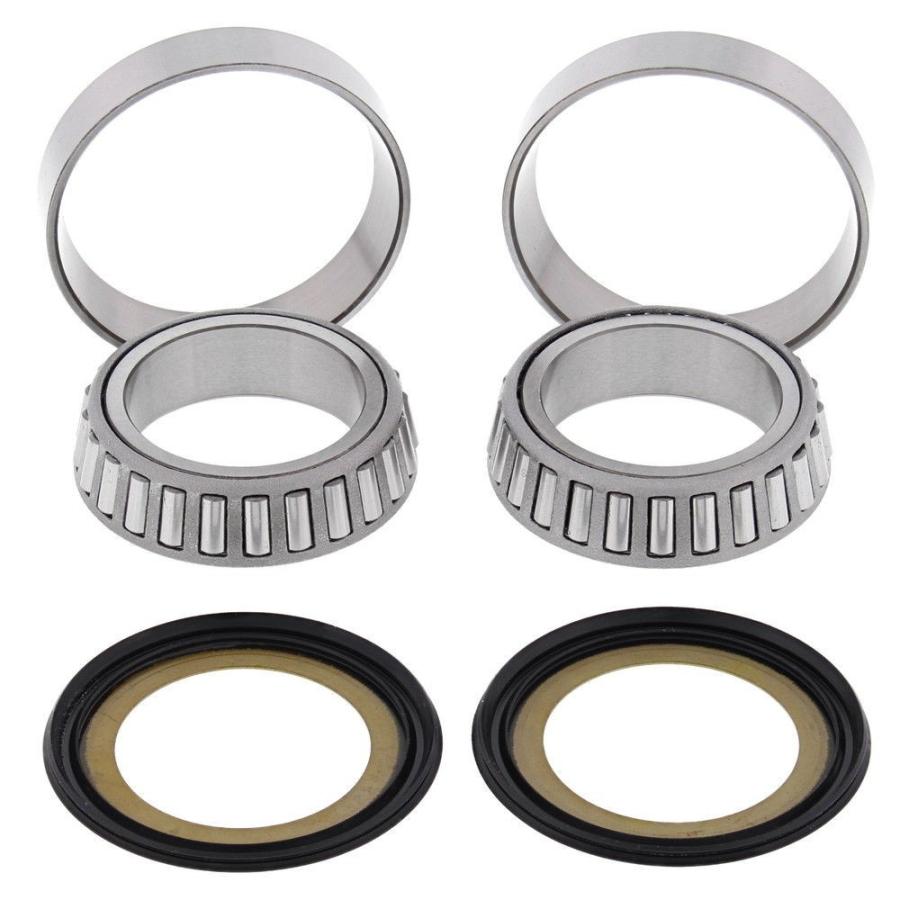 Two tapered roller bearings and two seal rings for a Honda RVF (RC45) steering bearing kit on a white background.