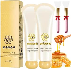 Two tubes of honey tearing mask displayed with a gold box, two applicator brushes, and honey imagery.