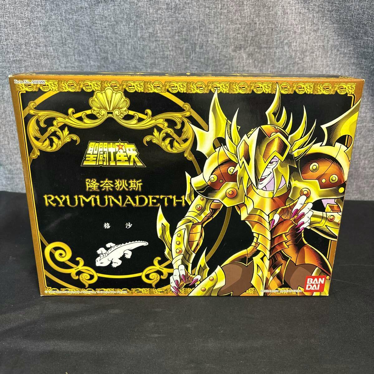 Front of the Bandai boxed Saint Seiya figure packaging showing Ryumunadeth character artwork and product logo.