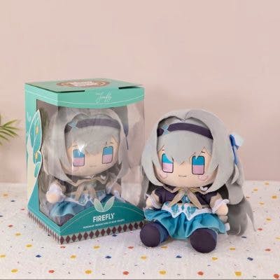 30cm Honkai: Star Rail Hotaru plush seated next to its retail box on a dotted surface.