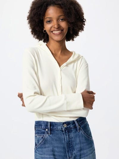 Model wearing an off-white hooded rib cotton sweater shown from the waist up, front view.