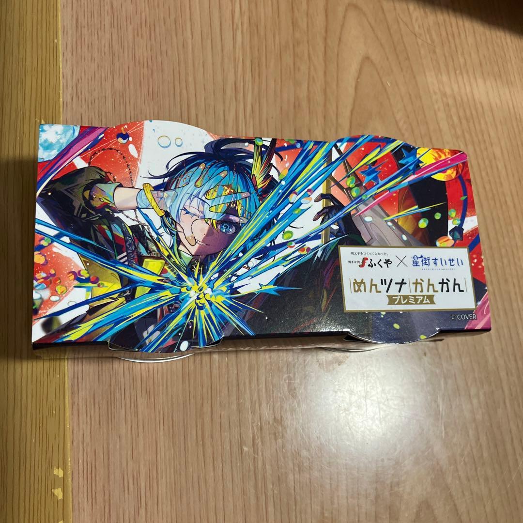 Colorful illustrated premium collaboration cardboard package for the canned tuna 'めんツナかんかん' showing character artwork.