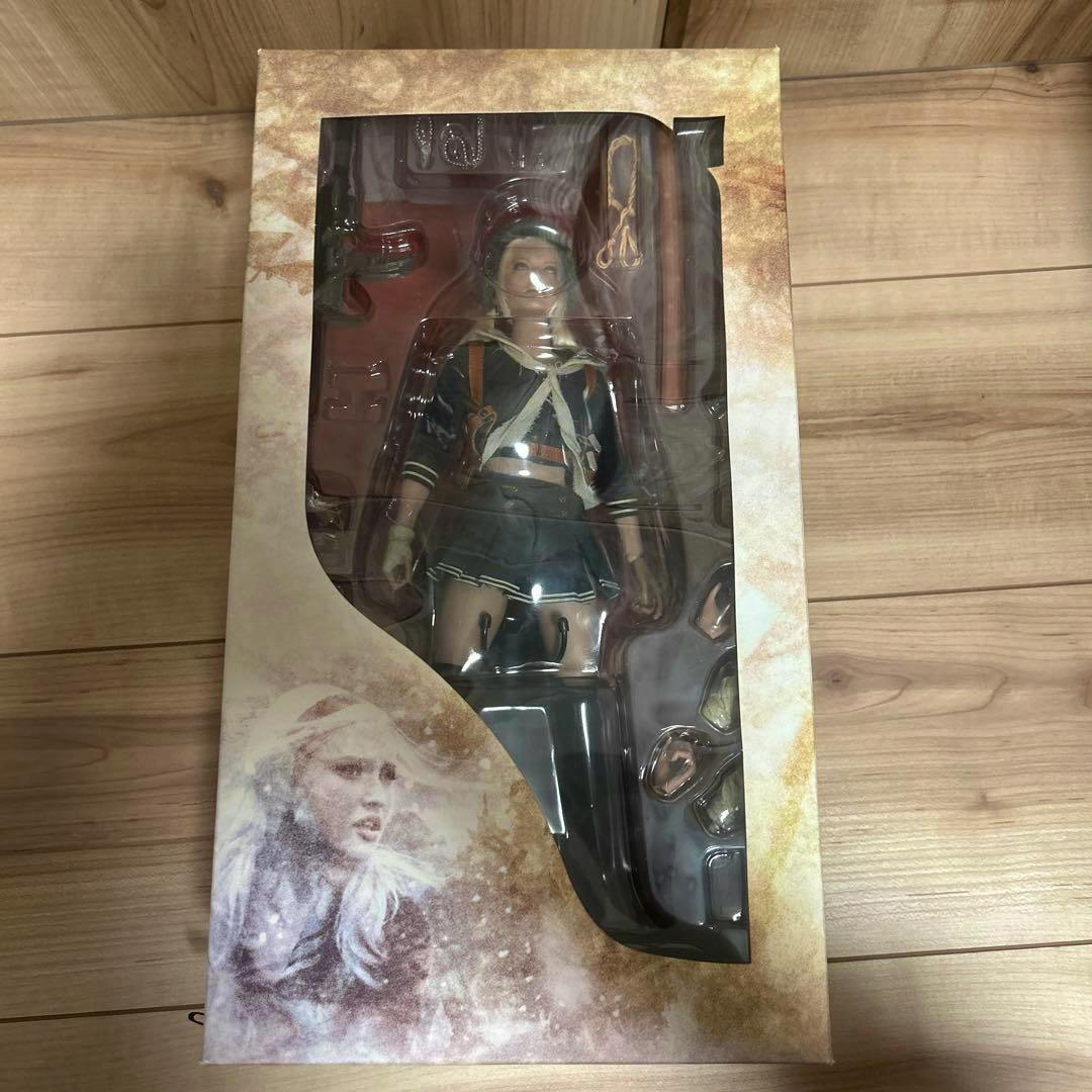 Windowed packaging showing the Hot Toys Babydoll figure from Sucker Punch and included accessories.