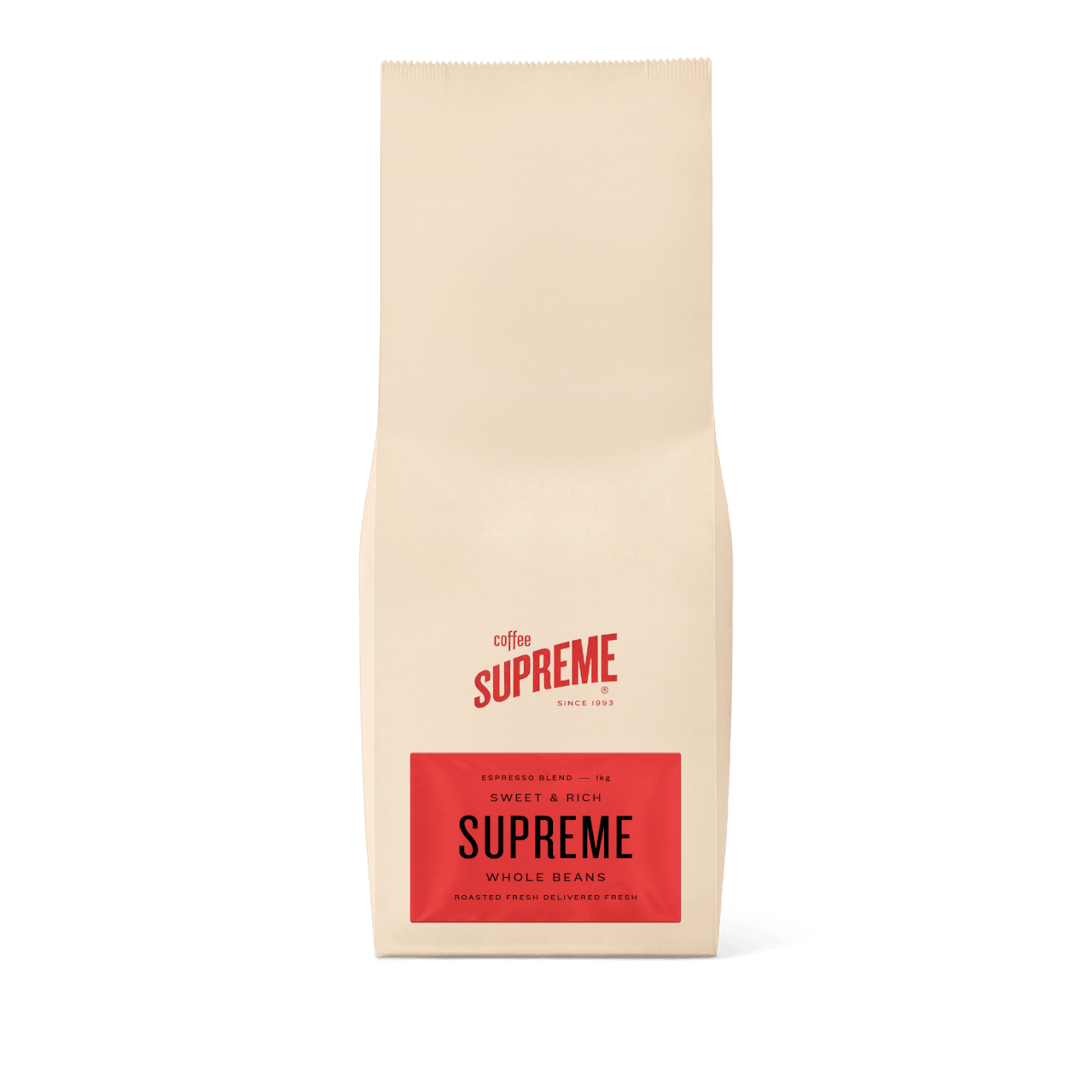 Front view of a beige 1kg bag of Supreme whole bean coffee with a red label.