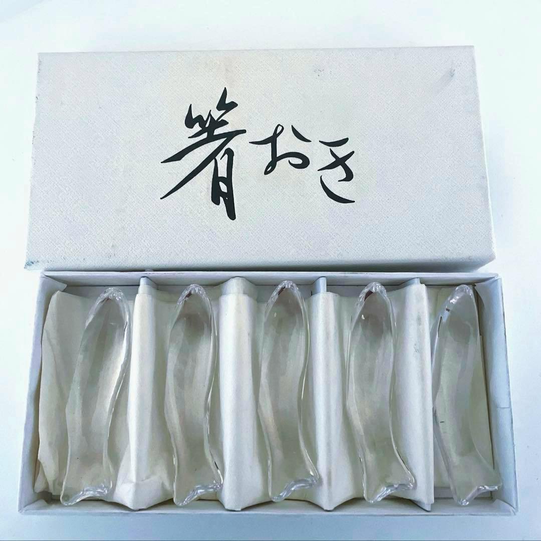 Boxed HOYA crystal glass fish-shaped chopstick rests displayed in a white box with Japanese writing on the lid.