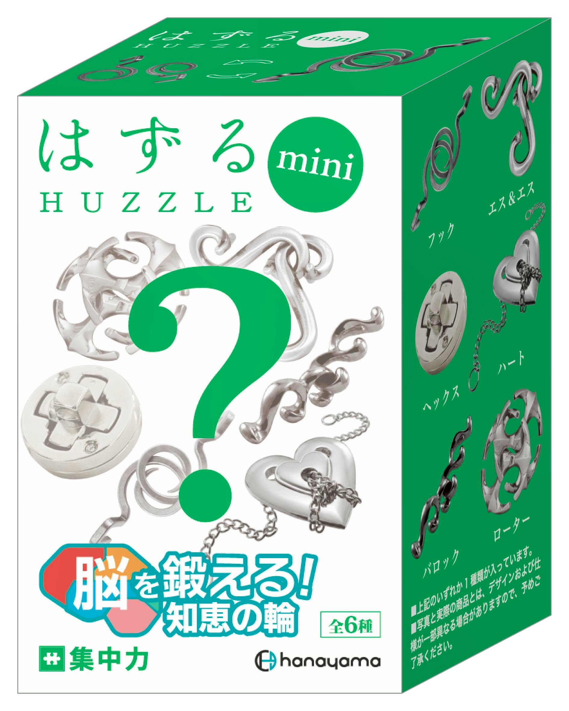 Green-and-white Huzzle mini product box for はずるmini 集中力 showing silver metal puzzle pieces and Japanese text, labeled as a complete six-type box.
