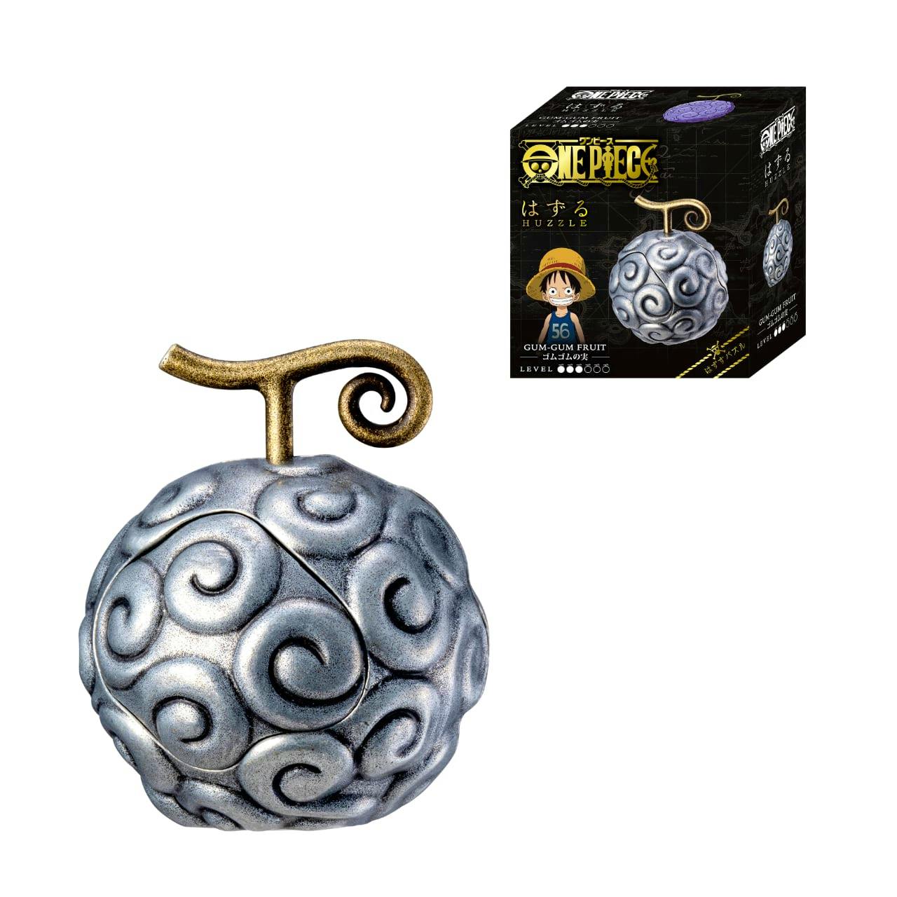 Metal puzzle toy modeled as the One Piece Gum-Gum Fruit with the product box shown in the corner.