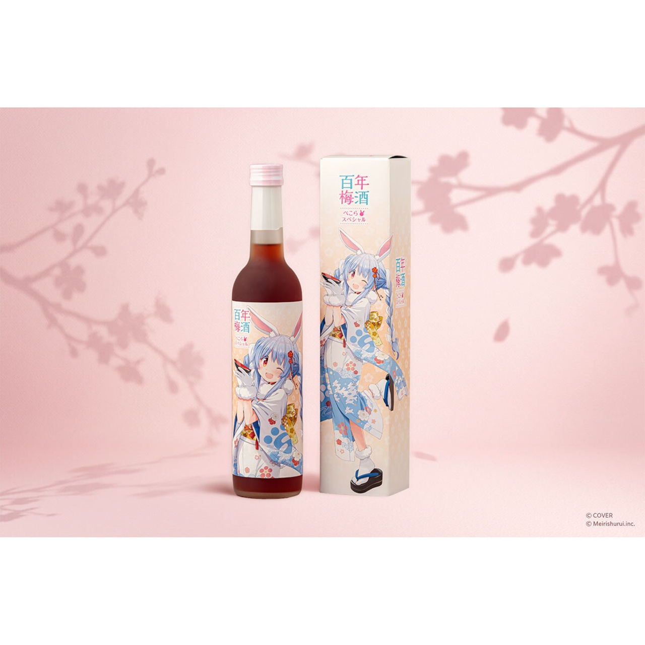 A 500ml bottle of plum wine with an illustrated character label shown beside its matching decorative box against a pink background.