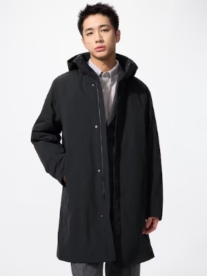 Male model wearing the men's hybrid down oversized MA-1 jacket with hood against a white background.