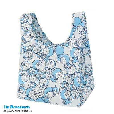 Mini eco bag showing an all-over blue Doraemon character print on a white background.