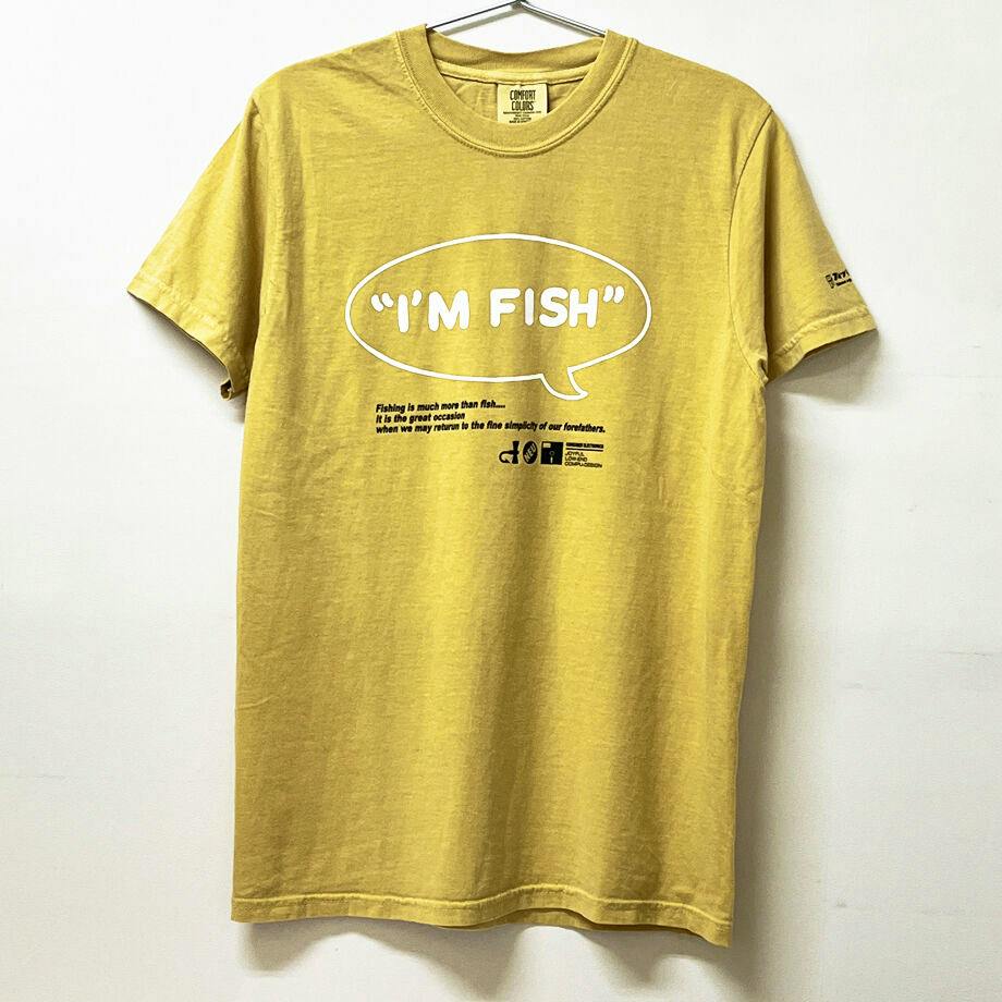 Front view of the mustard-colored T-shirt hanging on a hanger, showing the "I'M FISH" speech-bubble print.