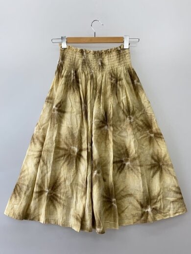 Front view of a women's cotton skirt (I.S. ISSEY MIYAKE SPORT) hanging on a wooden hanger against a white background.