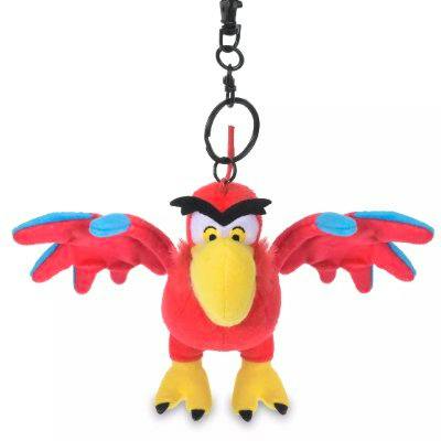 Red Iago plush keychain with outstretched wings, a yellow beak, and a metal clip.