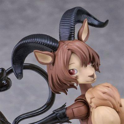 Close-up of the doll's head and upper torso showing curved ibex-like horns, animal ears, and a stylized face.