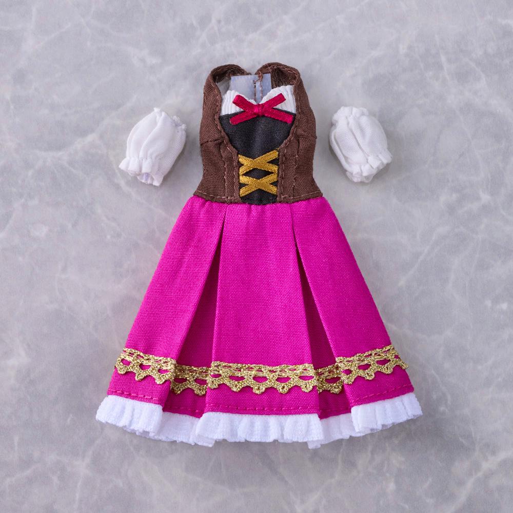 A pink and brown doll dress with detached white puff sleeves laid flat on a marble background.