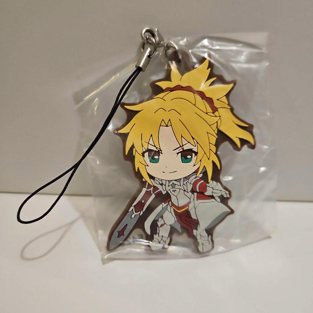 Rubber keychain of "赤のセイバー" (Red Saber) from Fate/Apocrypha shown in its plastic bag with a black strap.