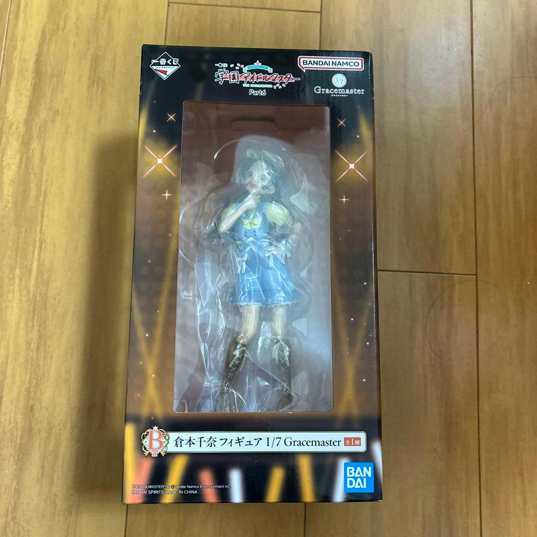 Boxed 一番くじ 学園アイドルマスター B賞 倉本千奈 1/7 Gracemaster plastic figure visible through the front window of the box.