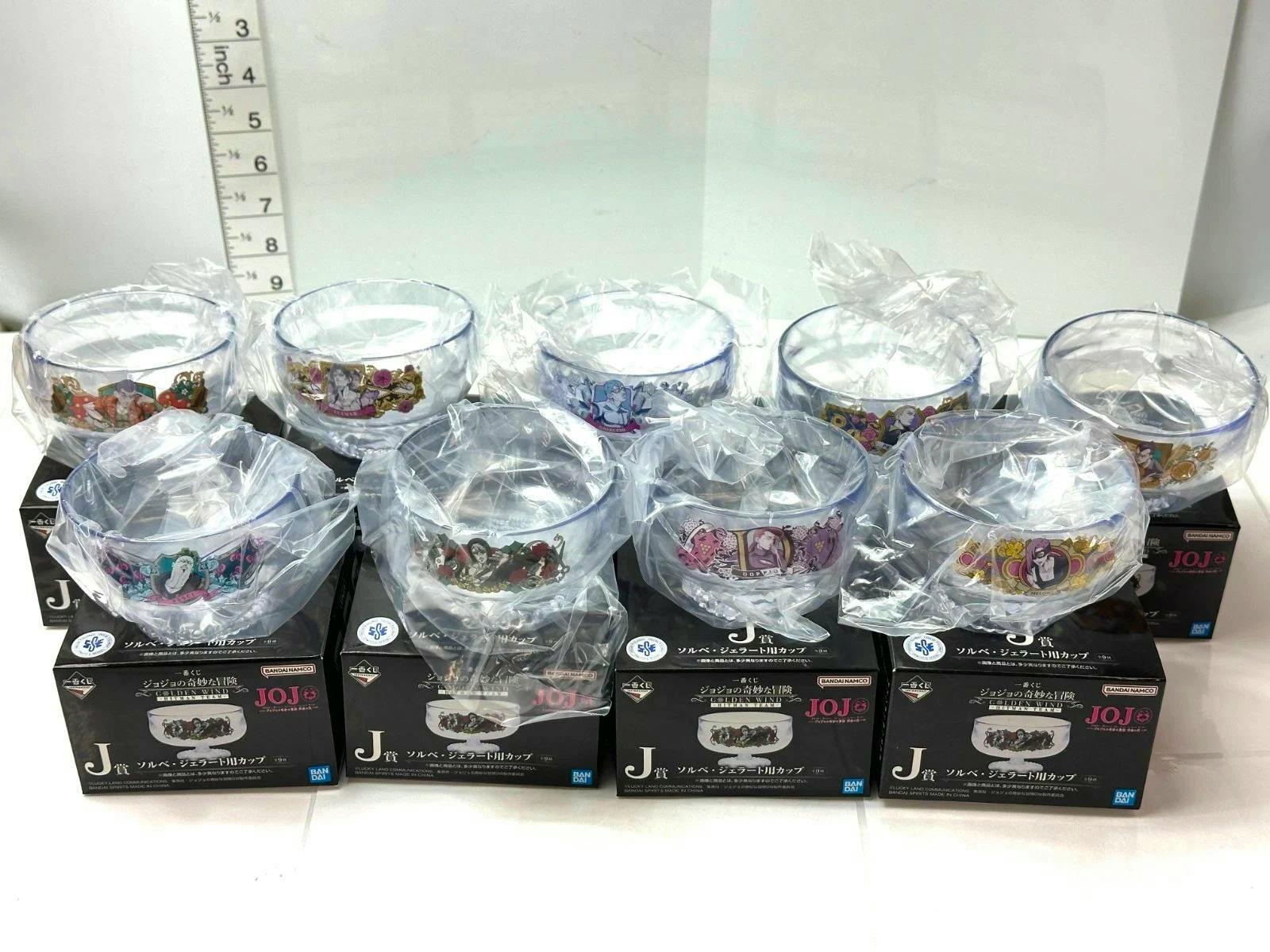 Nine clear plastic JoJo's Bizarre Adventure: Golden Wind J‑prize sorbet/gelato cups, each wrapped in plastic and displayed on their boxes.