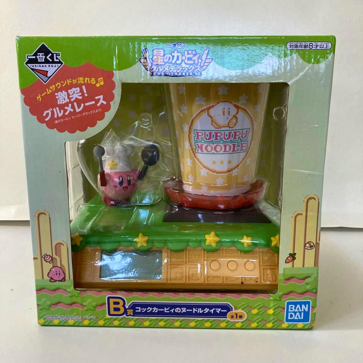 Unopened boxed B‑prize Kirby Cook noodle timer figure showing a Kirby mini‑figure and a noodle cup visible through the front window.