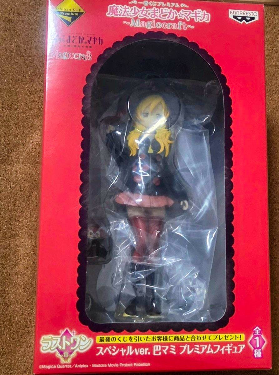 Boxed Magicraft 巴マミ (Mami Tomoe) premium figure visible through the red package window.