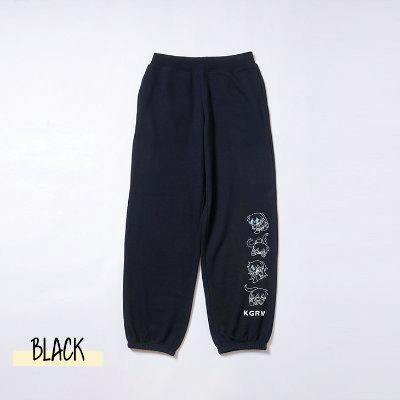 Black men's sweatpants laid flat showing character graphic prints on the lower leg and elastic cuffs.