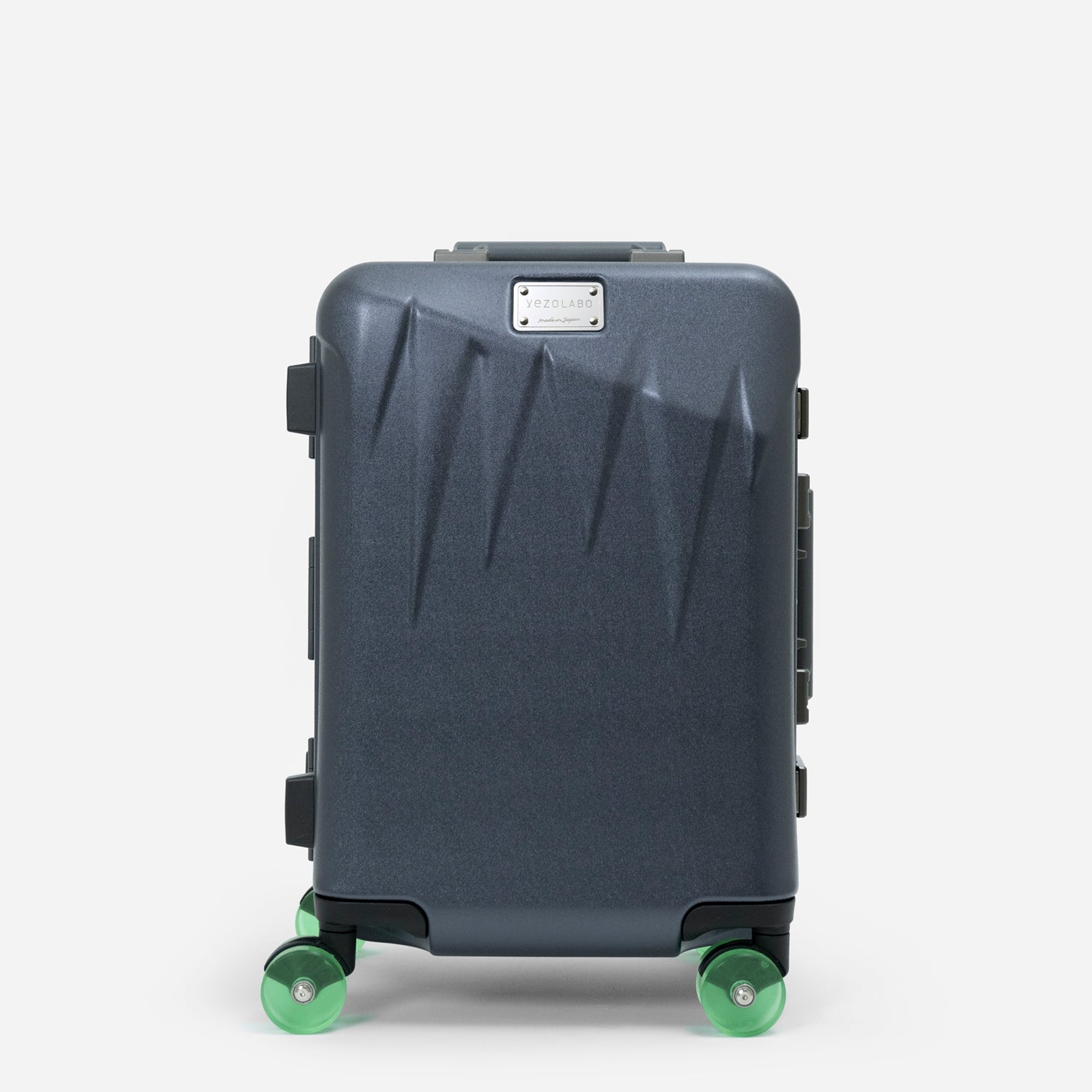 Front view of the ICICLE frame cabin suitcase with a dark-gray shell and green wheels on a white background.