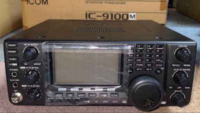 Front panel of the ICOM IC-9100M transceiver showing its display, buttons, and knobs.