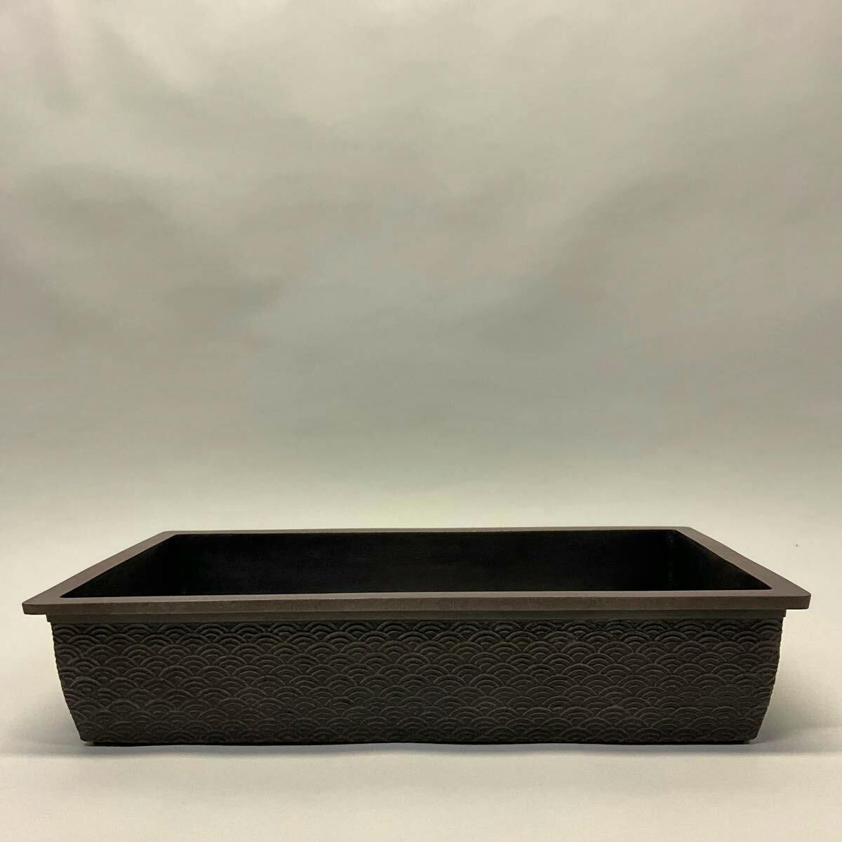 Rectangular shallow ceramic flower pot with seigaiha wave pattern shown from the front on a neutral background.