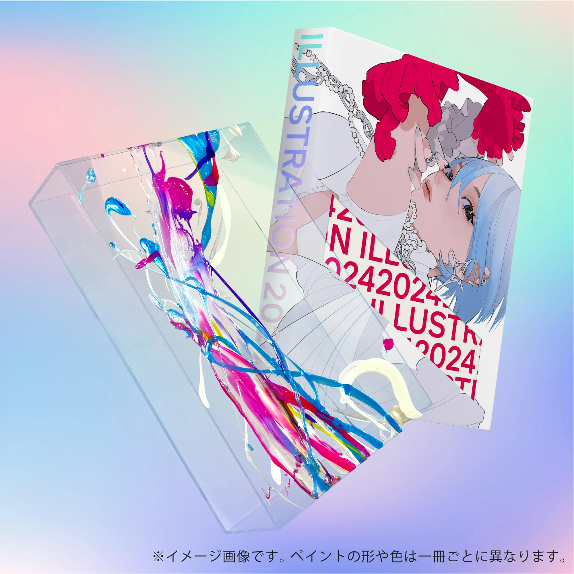 Angled view of the book and its clear acrylic box with colorful paint splashes.